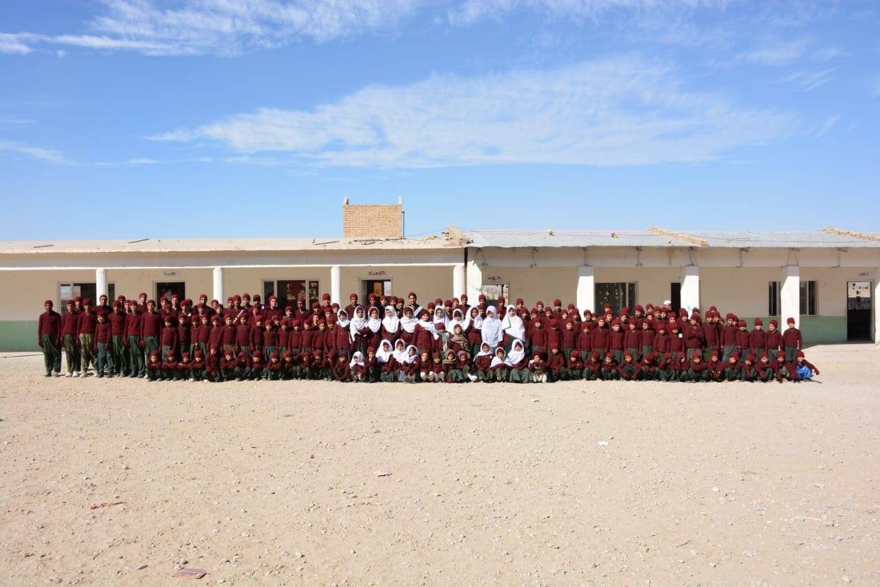 The whole school gathered outside Wilderness Public School, Umerabad